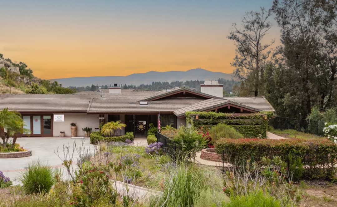Front of Memory Care building with views of sunset