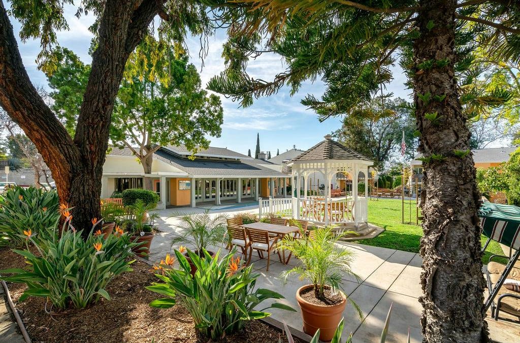 Seniors Housing Building outside with beautiful flowers and trees