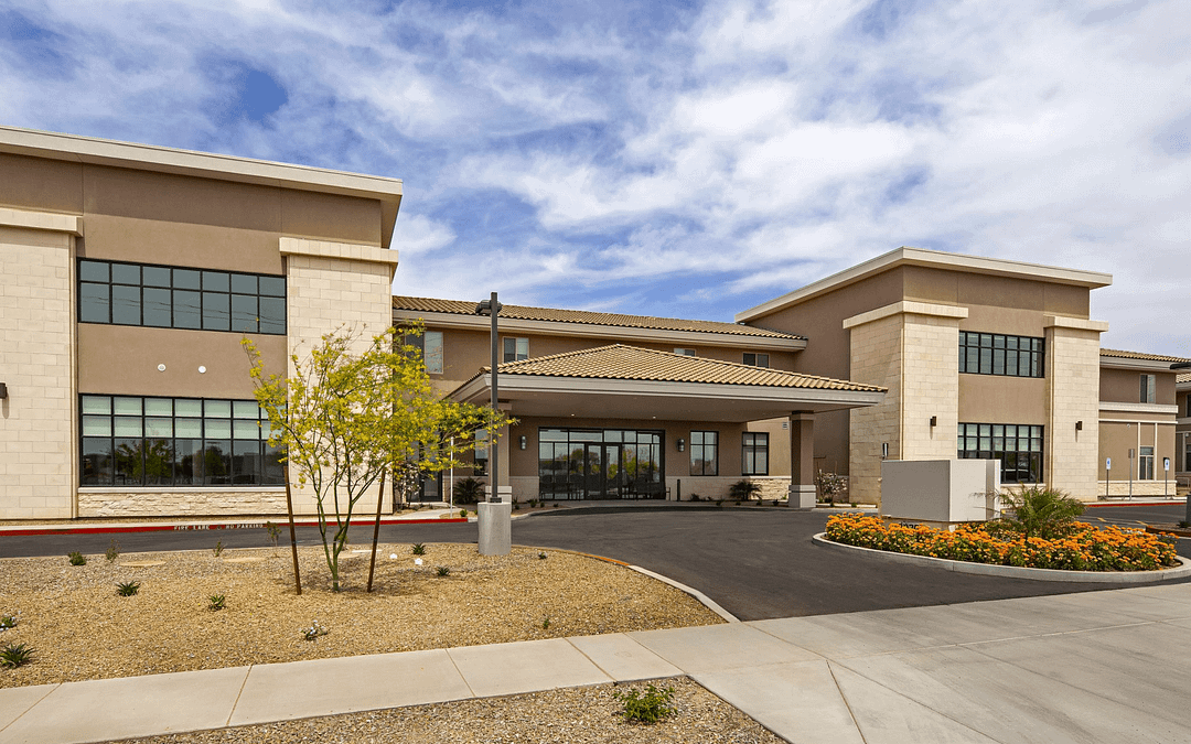 Front of Seniors Housing Community in Phoenix Arizona. Two story building with large entrance way.