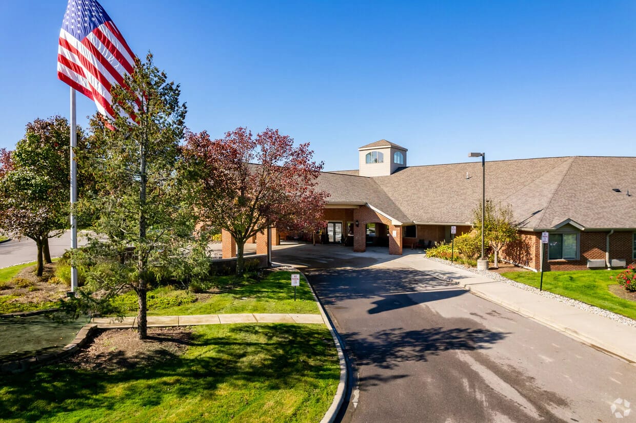 Front of Independent living building in Michigan with American Flag and driveway
