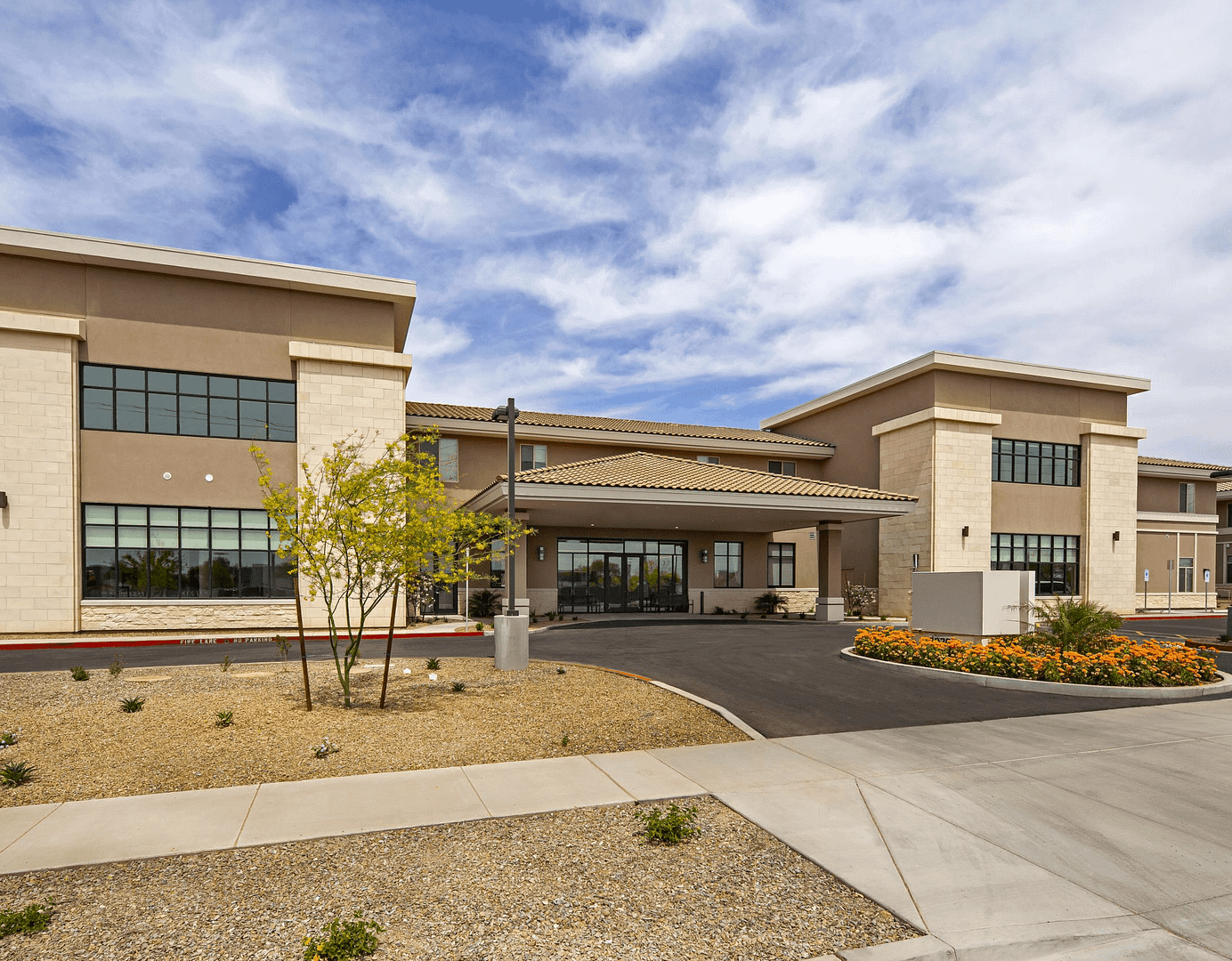 Front of Seniors Housing Community in Phoenix Arizona. Two story building with large entrance way.